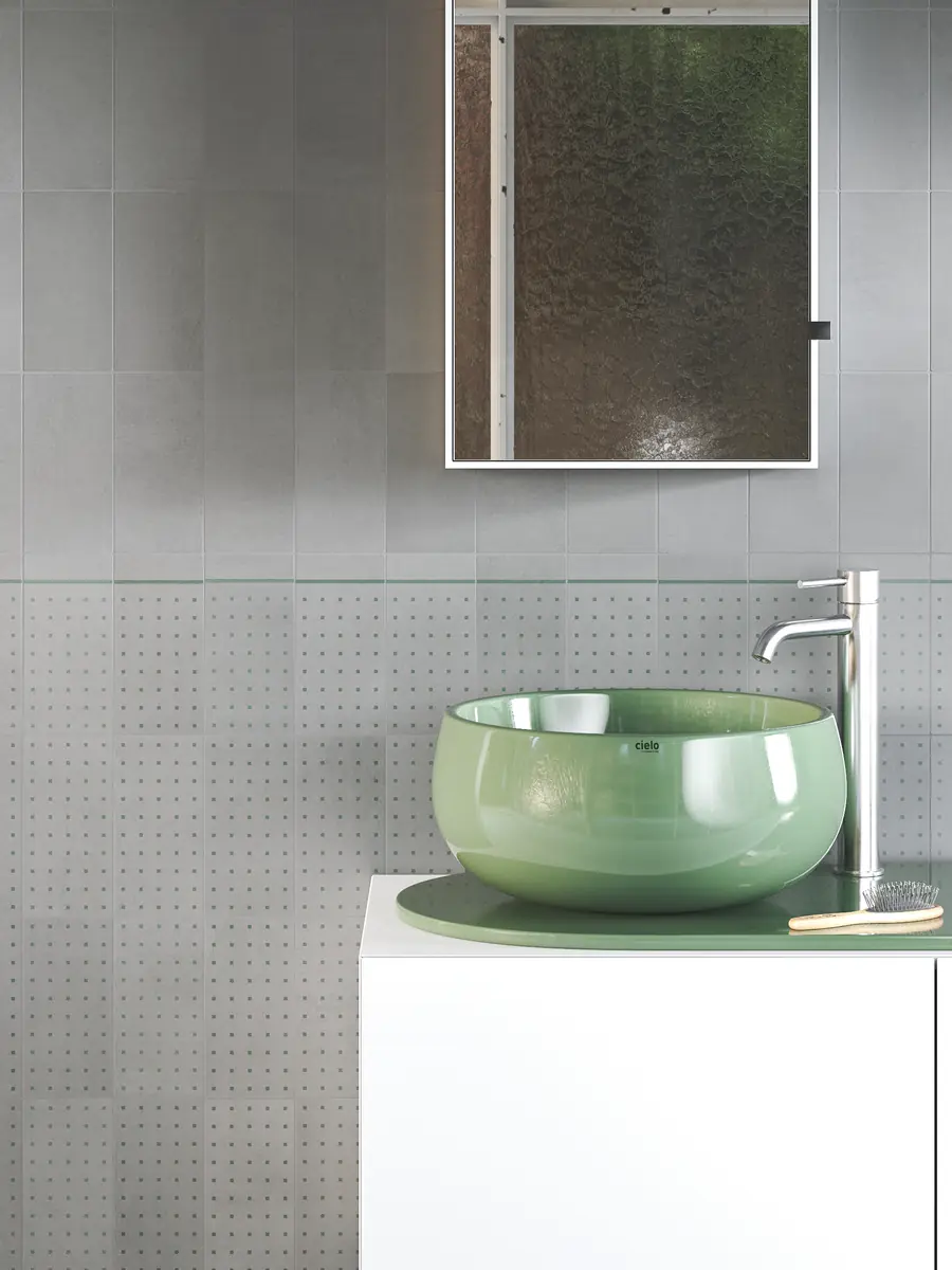 Bathroom wall with grey cement tiles
