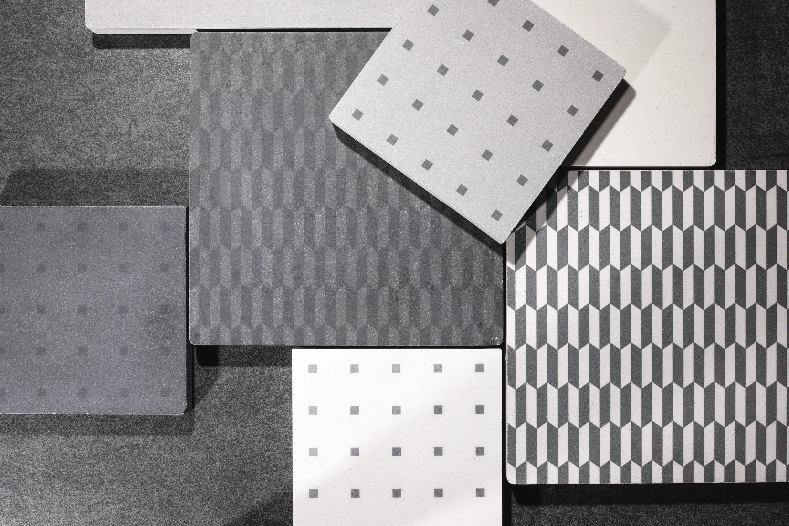 Cement tiles in white, grey and black cement