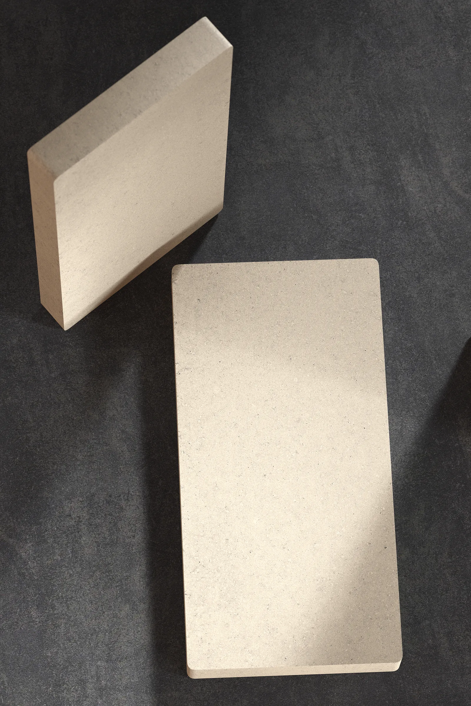 Detail of two Dune sand-colour tiles and 18 mm exposed concrete profile