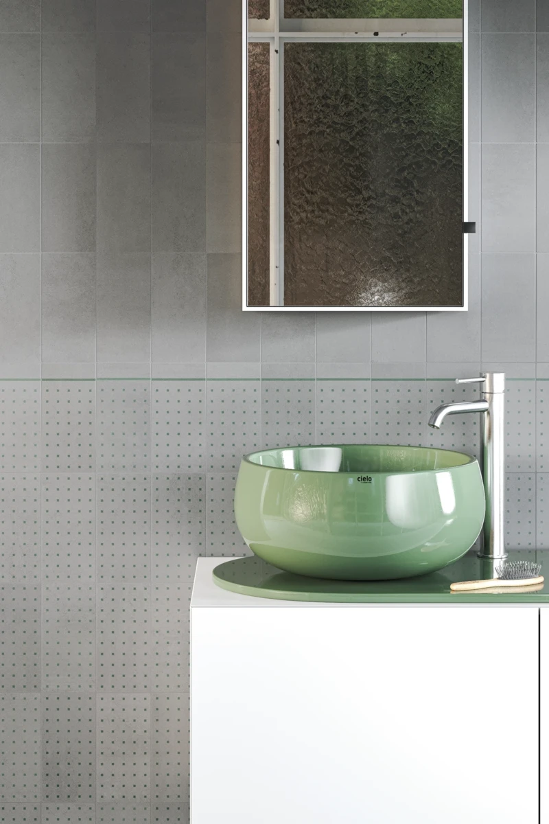 Bathroom wall with grey cement covering