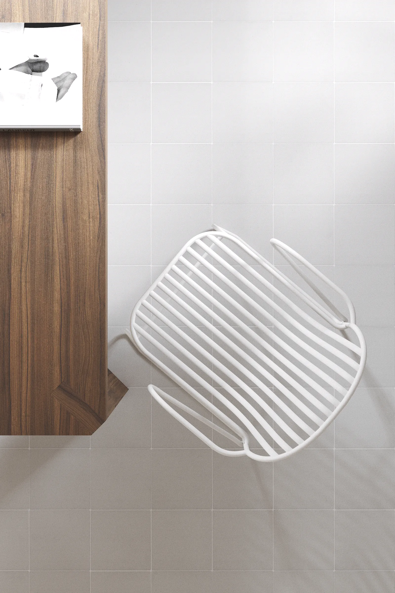 Top-down view of a kitchen floor paved with warm white Mediterranean-style tiles next to a wooden table and a white metal chair